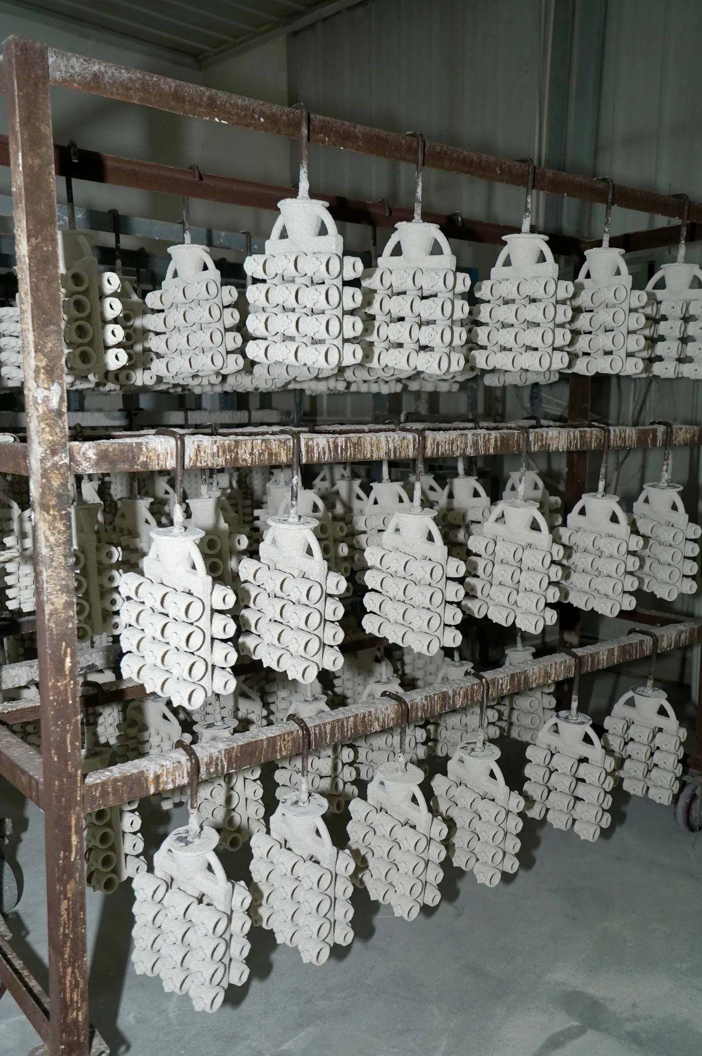 Ceramic shell molds drying on factory racks